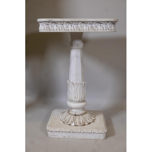 1214 - A marble pedestal with carved frieze top, raised on a tapering column with lotus leaf decoration, A/... 