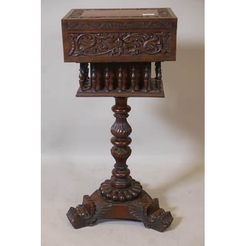 1218 - An Anglo-Indian padauk wood workbox, with carved decoration and galleried well, raised on a carved c... 