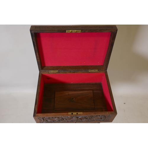 1218 - An Anglo-Indian padauk wood workbox, with carved decoration and galleried well, raised on a carved c... 