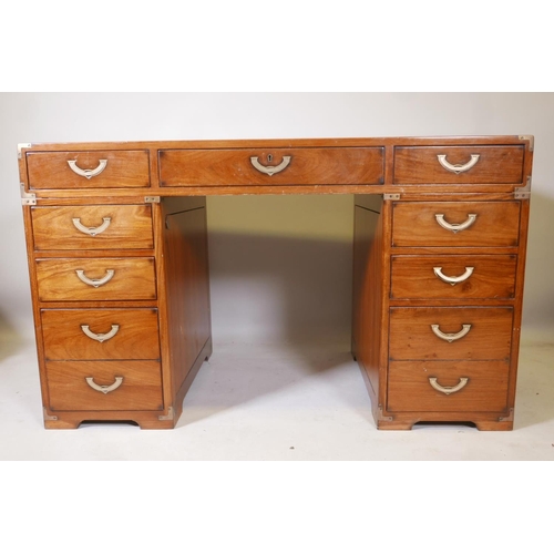 1222 - A Starbay hardwood maritime style, nine drawer pedestal desk, with inset campaign style handles and ... 