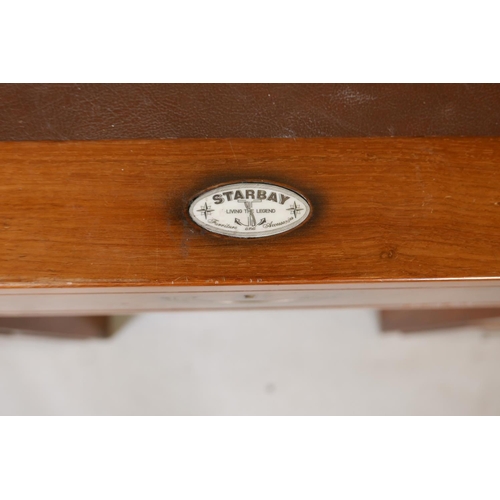 1222 - A Starbay hardwood maritime style, nine drawer pedestal desk, with inset campaign style handles and ... 