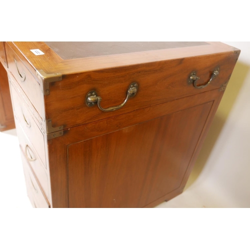 1222 - A Starbay hardwood maritime style, nine drawer pedestal desk, with inset campaign style handles and ... 