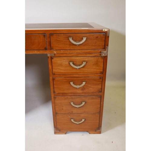 1222 - A Starbay hardwood maritime style, nine drawer pedestal desk, with inset campaign style handles and ... 