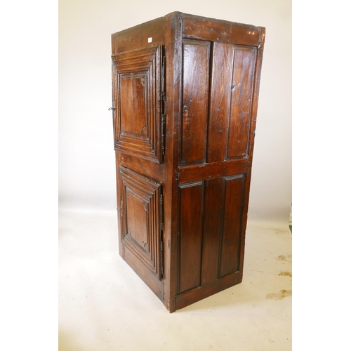 1227 - A French oak cupboard with two doors and panelled sides, late C17th/early C18th, 31