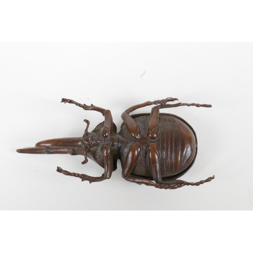 15 - A Japanese Jizai style bronze long horn beetle, the carapace opening to reveal a box, 4½