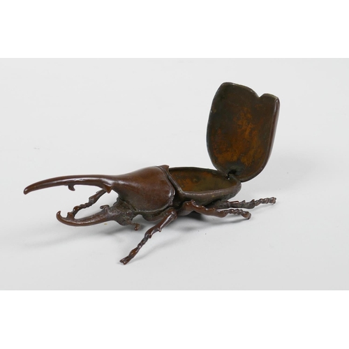 15 - A Japanese Jizai style bronze long horn beetle, the carapace opening to reveal a box, 4½