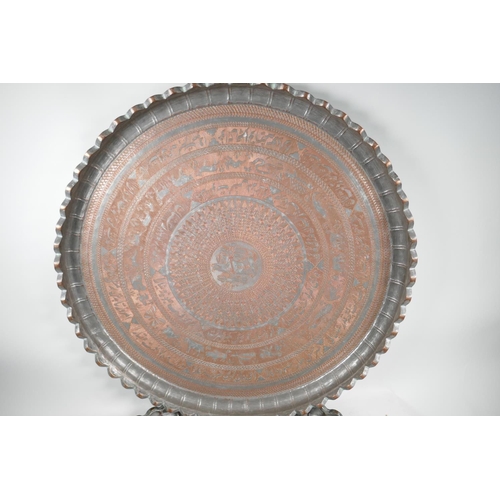 17 - An Islamic silvered cast copper tray with frilled rim engraved with animals, scrolls etc, 29