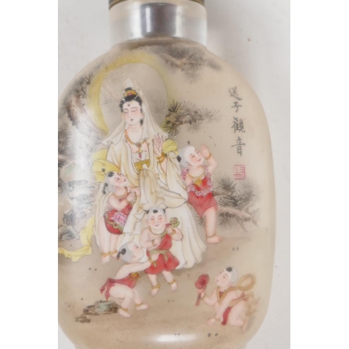 19 - A Peking glass snuff bottle with interior decoration depicting a lady with five children, the revers... 