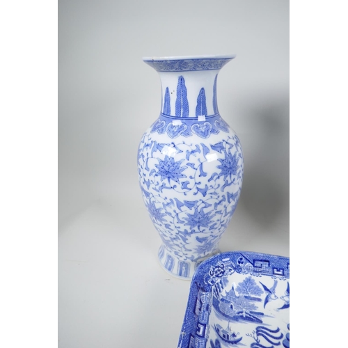 22 - A pair of Chinese blue and white vases decorated with stylised flowers, 12