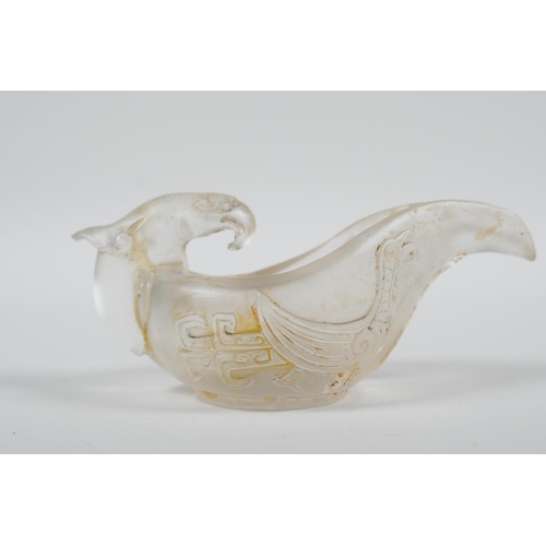 23 - A Chinese glass libation cup/pourer with stylised phoenix decoration, 4½