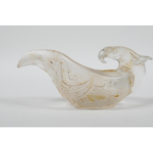 23 - A Chinese glass libation cup/pourer with stylised phoenix decoration, 4½