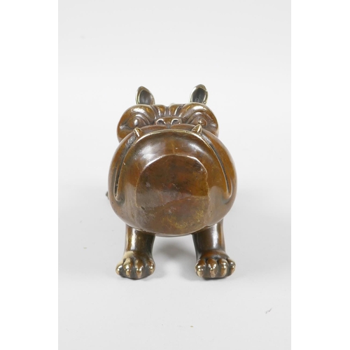 33 - A filled bronze figure in the form of a comical bulldog, 5½