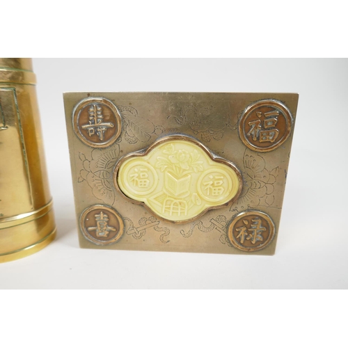 44 - A Chinese engraved brass table cigarette box, the cover set with good luck symbols, 4¼