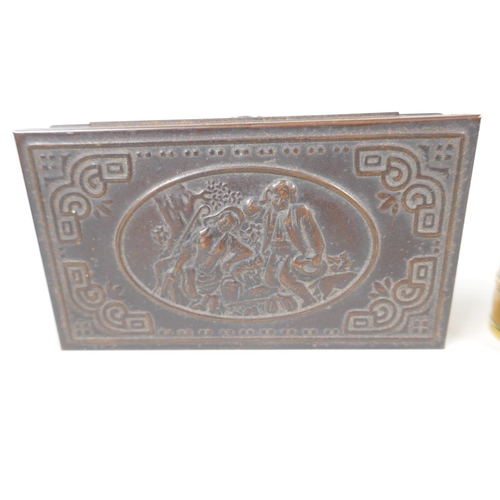 44 - A Chinese engraved brass table cigarette box, the cover set with good luck symbols, 4¼