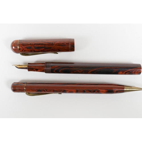 55 - A collection of early British fountain pens to include 'The Guinea', a 'Golden Guinea', an 'Onoto', ... 