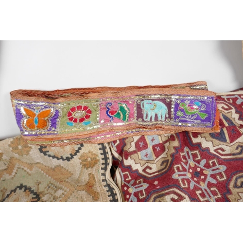 64 - A Vintage Uzbekistan suzani embroidered door drape, an Indian pelmet, two Uzbekistan suzani embroide... 