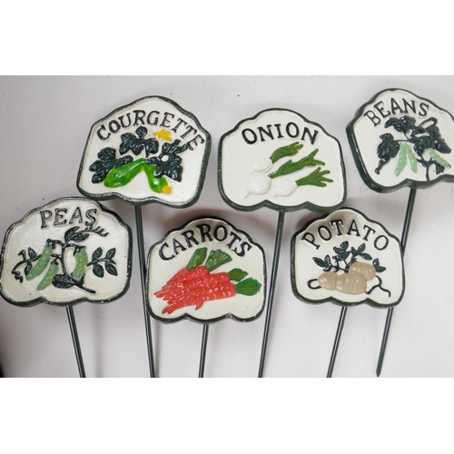 66 - A set of six painted cast metal vegetable markers, 4¼