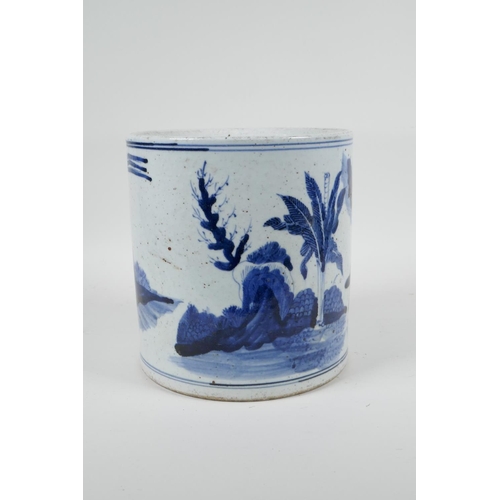 70 - A Chinese Republic period blue and white porcelain brush pot decorated with figures in a landscape, ... 