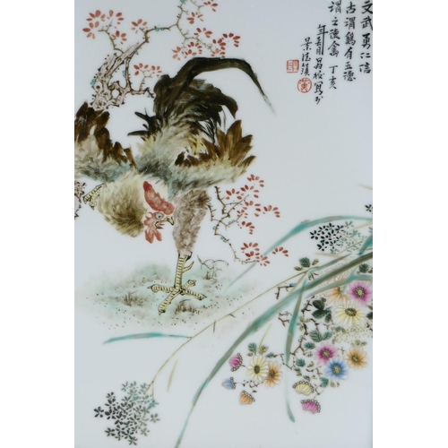 71 - A Chinese polychrome porcelain panel decorated with a rooster and flowers in a hardwood frame, 13