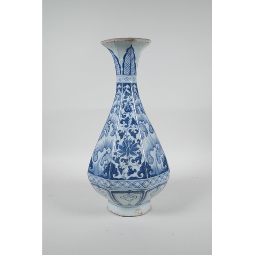 73 - A Chinese Yuan style blue and white pottery pear shaped vase of octagonal form with floral decoratio... 