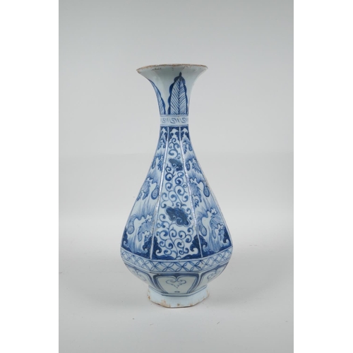 73 - A Chinese Yuan style blue and white pottery pear shaped vase of octagonal form with floral decoratio... 