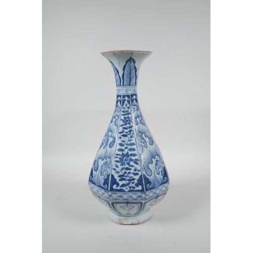 73 - A Chinese Yuan style blue and white pottery pear shaped vase of octagonal form with floral decoratio... 