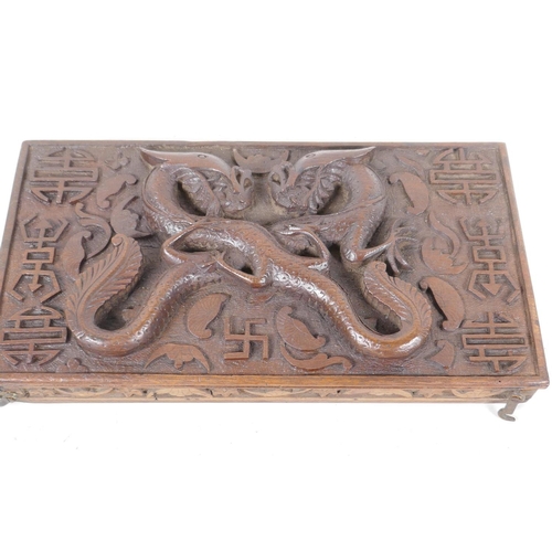 76 - An antique carved wood artist's box, the lid heavily carved with dragons and symbols inside and out,... 