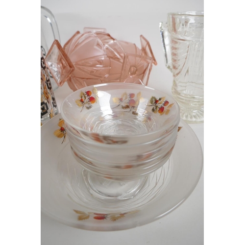 77 - An Art Deco pink glass fruit service of serving bowl and six pedestal bowls together with a vintage ... 