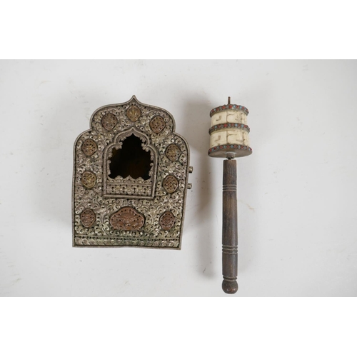 79 - A Tibetan copper and embossed white metal shrine, 5½