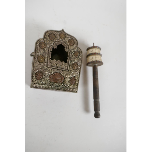 79 - A Tibetan copper and embossed white metal shrine, 5½