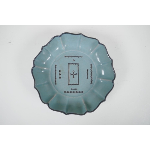 80 - A Chinese Ru ware style celadon glazed dish of lobed form, with chased decoration to the bowl, 7&fra... 