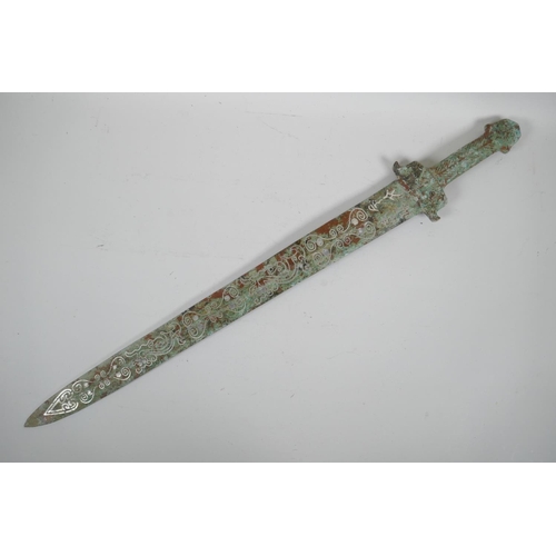 81 - A Chinese archaic style mixed metal short sword, the blade with stylised line decoration, 26