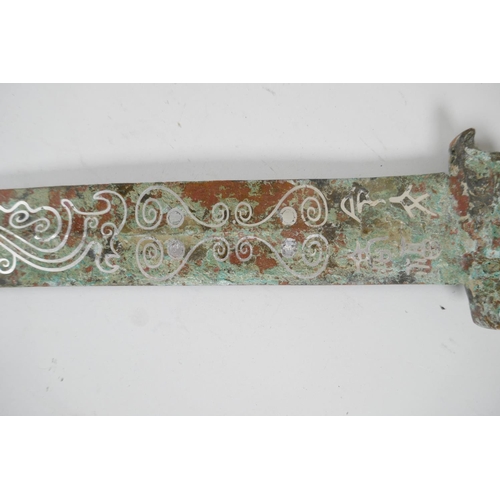 81 - A Chinese archaic style mixed metal short sword, the blade with stylised line decoration, 26