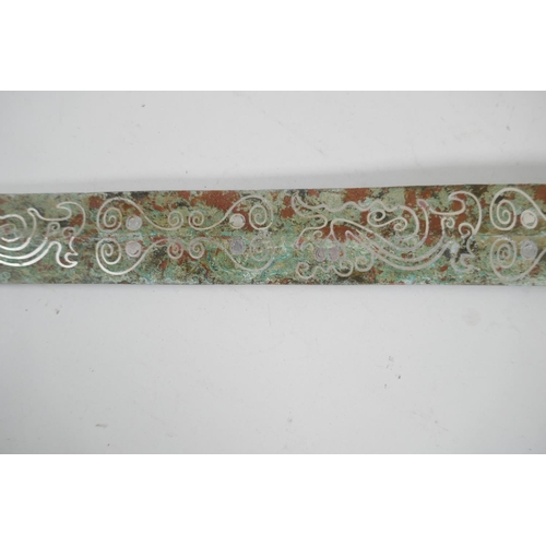 81 - A Chinese archaic style mixed metal short sword, the blade with stylised line decoration, 26