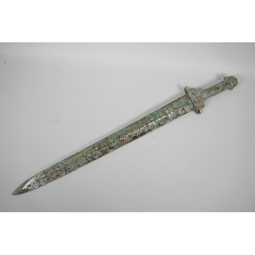 81 - A Chinese archaic style mixed metal short sword, the blade with stylised line decoration, 26