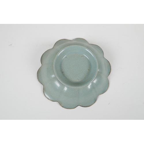 88 - A Chinese Song style celadon crackle glazed bowl of petal form, with a gilt rim, the bowl with chase... 