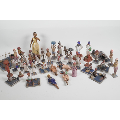 89 - A collection of 41 vintage Indian painted wood and terracotta figures