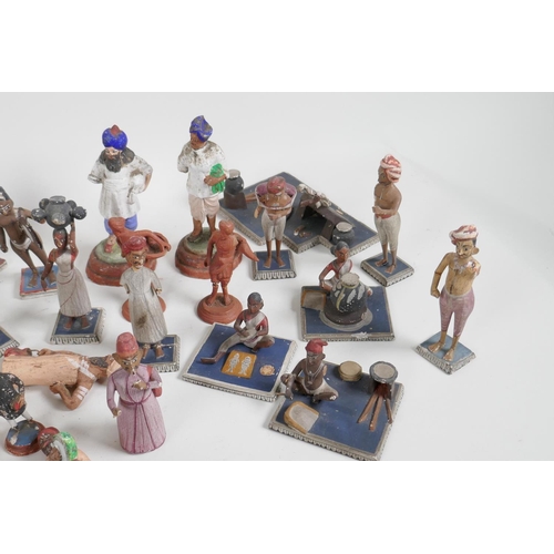 89 - A collection of 41 vintage Indian painted wood and terracotta figures