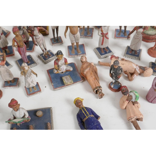 89 - A collection of 41 vintage Indian painted wood and terracotta figures