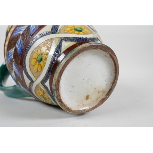 92 - A majolica water jug with scrolling leaf and sunflower decoration, 10