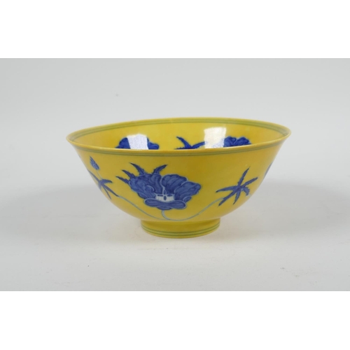 93 - A Chinese Ming style yellow ground porcelain rice bowl with blue and white floral decoration, 6 char... 