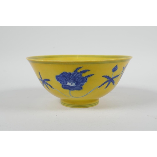 93 - A Chinese Ming style yellow ground porcelain rice bowl with blue and white floral decoration, 6 char... 