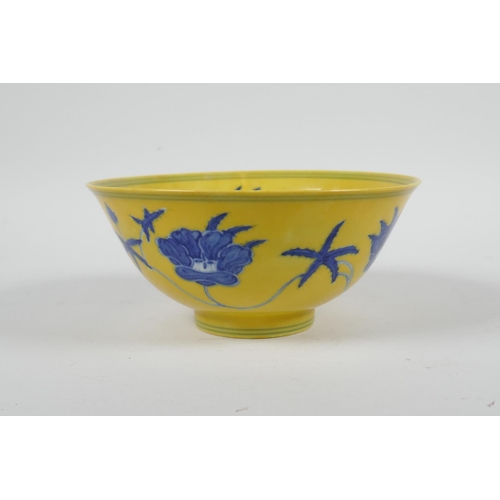 93 - A Chinese Ming style yellow ground porcelain rice bowl with blue and white floral decoration, 6 char... 