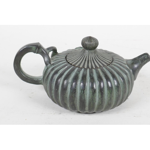 94 - A Chinese bronze teapot in the form of a gourd, 4 character mark to base, 5