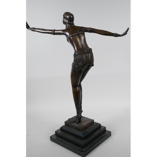 96 - An Art Deco style bronze figure of a dancing girl in the manner of Preiss on a stepped plinth, 15