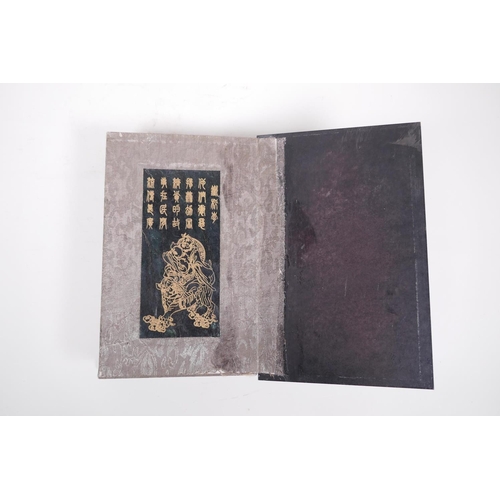 41 - A Chinese wood and silk bound book containing spinach jade tablets with engraved and gilt inscriptio... 