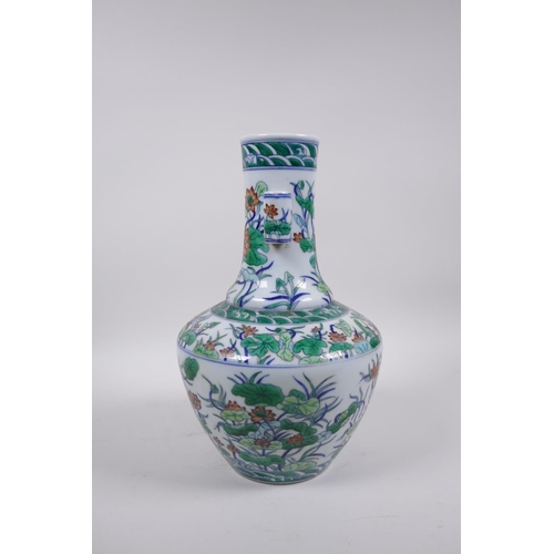 55 - A doucai porcelain vase with two lug handles and all over lotus flower decoration, seal mark to base... 