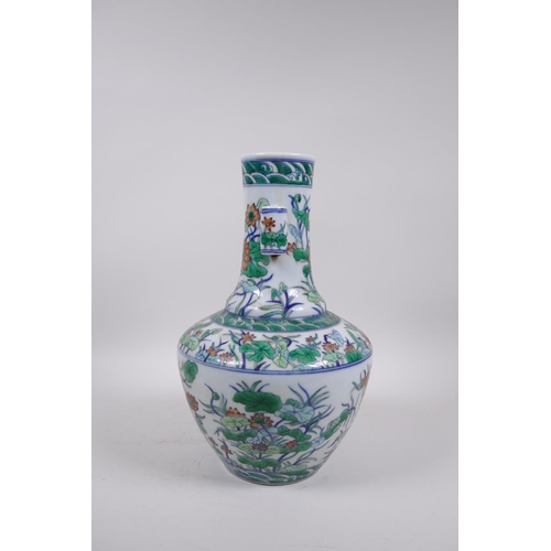 55 - A doucai porcelain vase with two lug handles and all over lotus flower decoration, seal mark to base... 