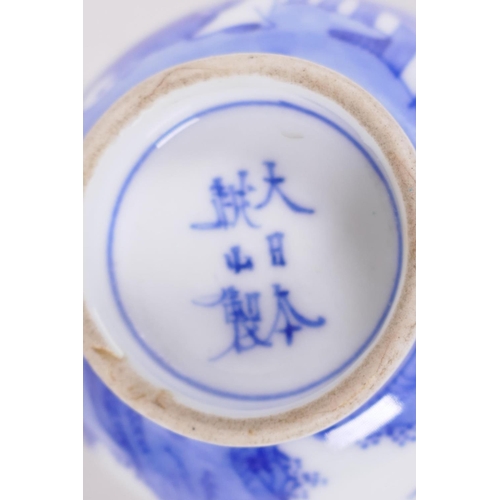 17 - A Chinese blue and white porcelain tea bowl decorated with a figure in a continuous landscape, 6 cha... 