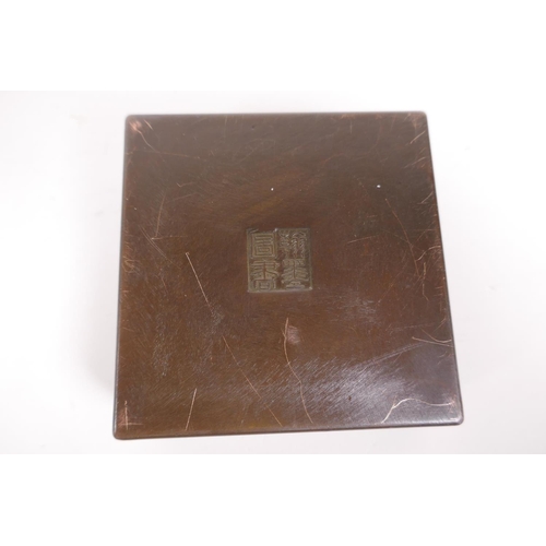 20 - A sino Tibetan bronze incense box and pierced cover, decorated with auspicious symbols, impressed se... 